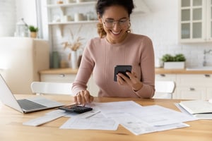 Happy woman making a budget