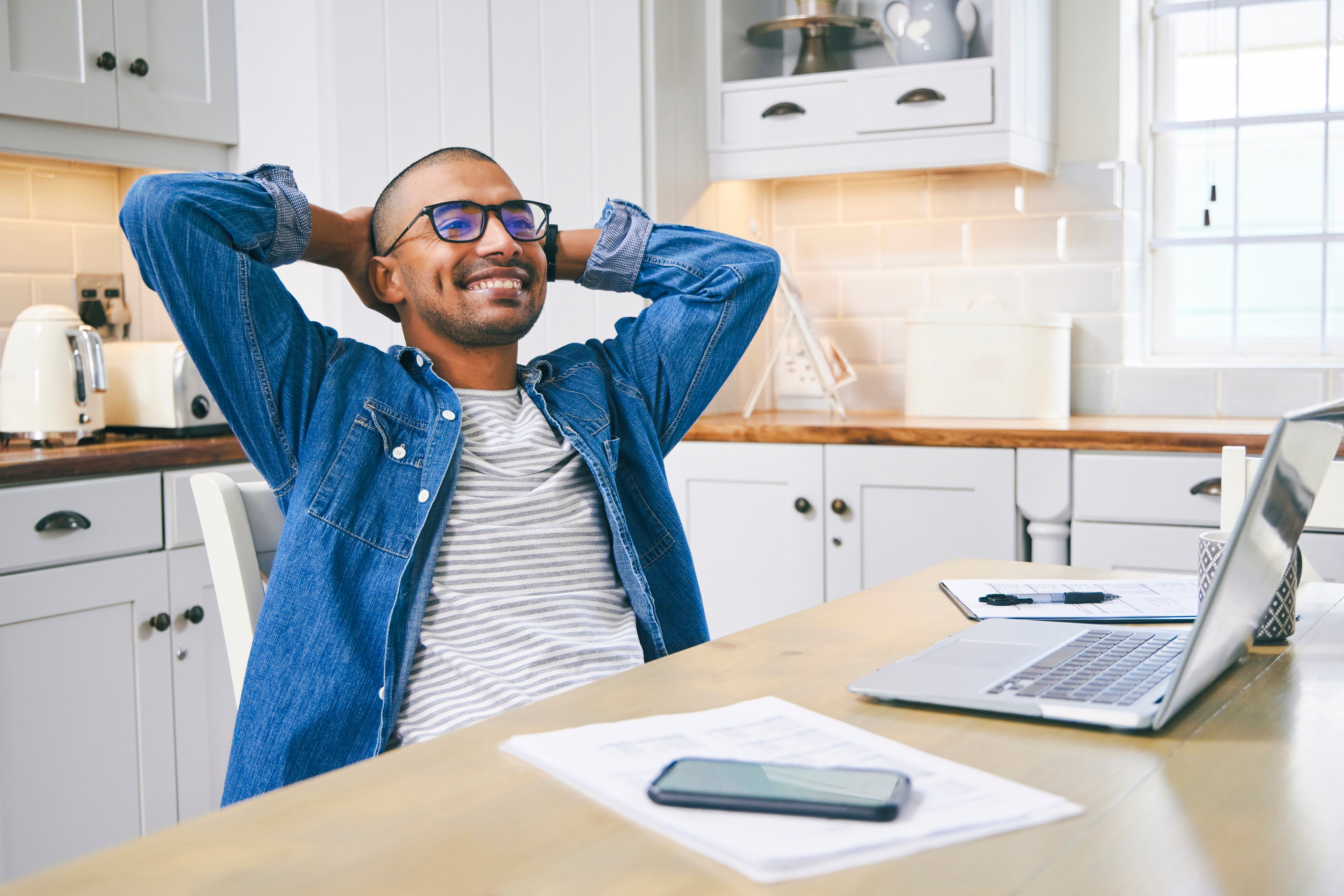 Man smiling at table