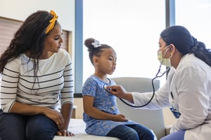 Mother and child with pediatrician