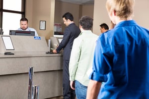 People standing in line at a credit union | First Alliance Credit Union