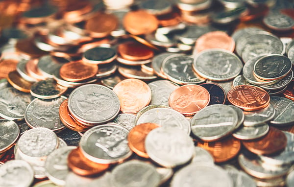 pile of coins waiting to be deposited at first alliance credit union