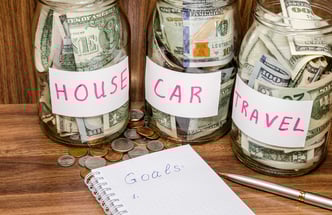labeled jars with money in them.