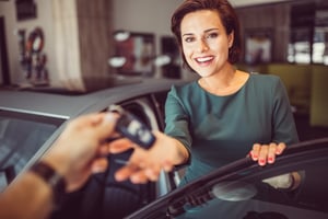 Woman getting new car keys