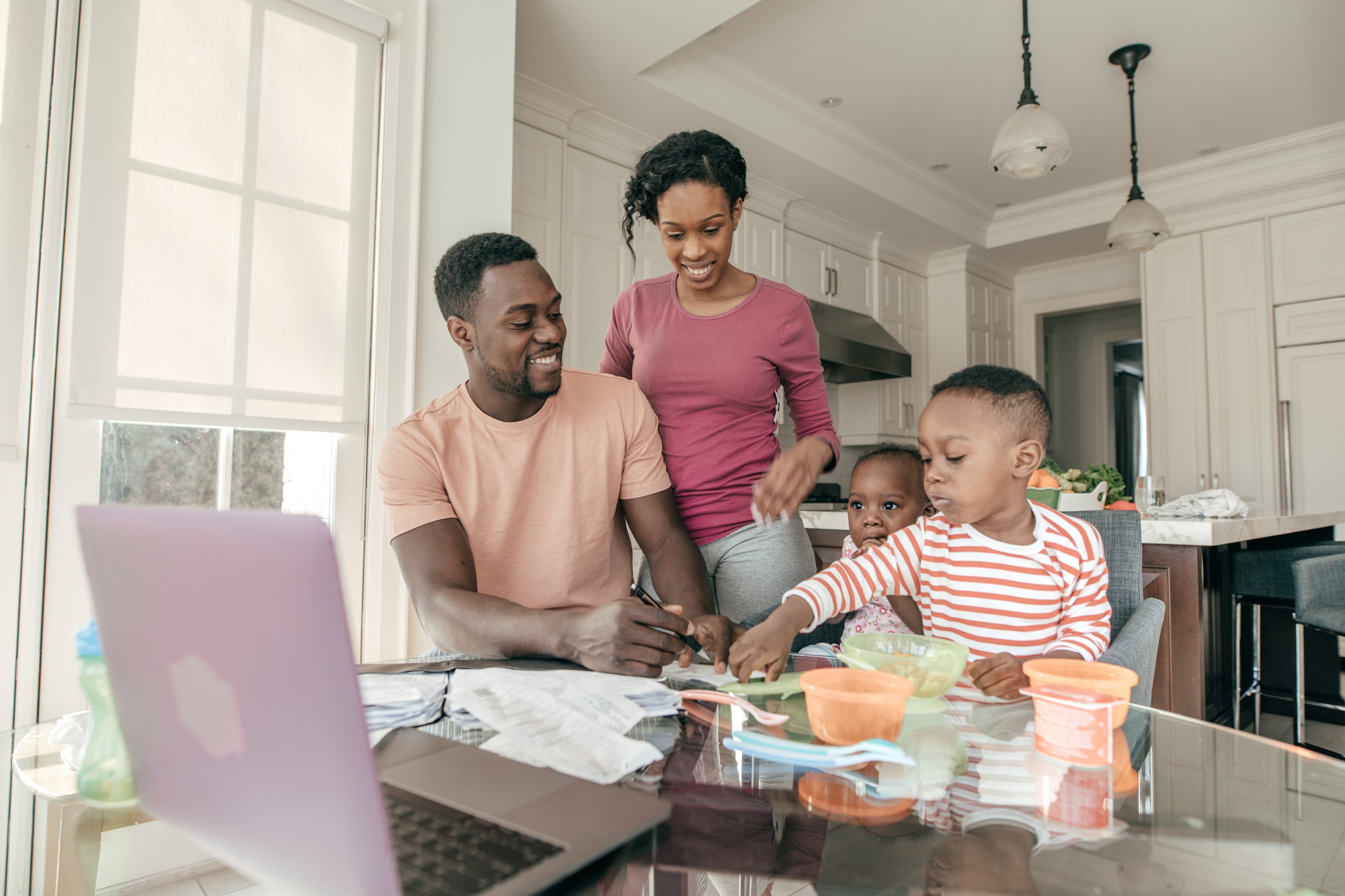 African American family review their advanced child tax credit online at first alliance credit union
