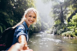 Female traveler holding hand