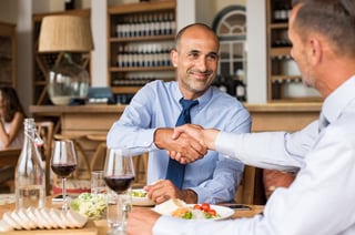 two men having business dinner meeting.jpg