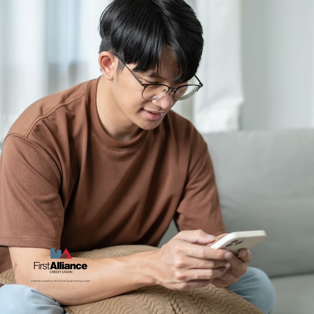 man with glasses on cell phone digital banking