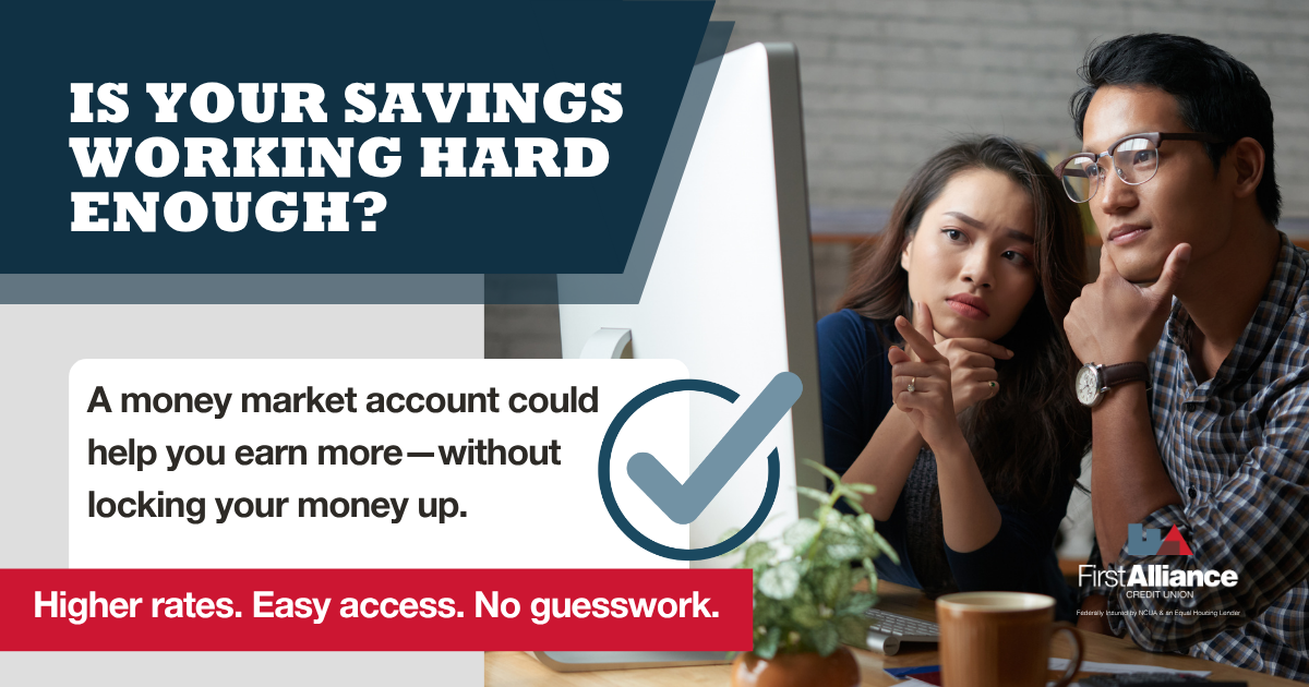 is your savings working hard enough? Couple on a computer reviewing money market accounts.