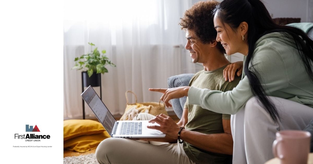 couple making a purchase from their laptop online
