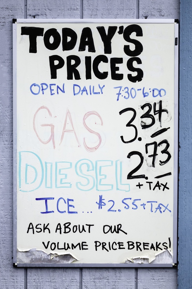 Price list, in U.S. currency, per gallon of fuel, by gas dock at marina store for fishermen and recreational boaters in the San Juan Islands, Washington, USA, in September 2015