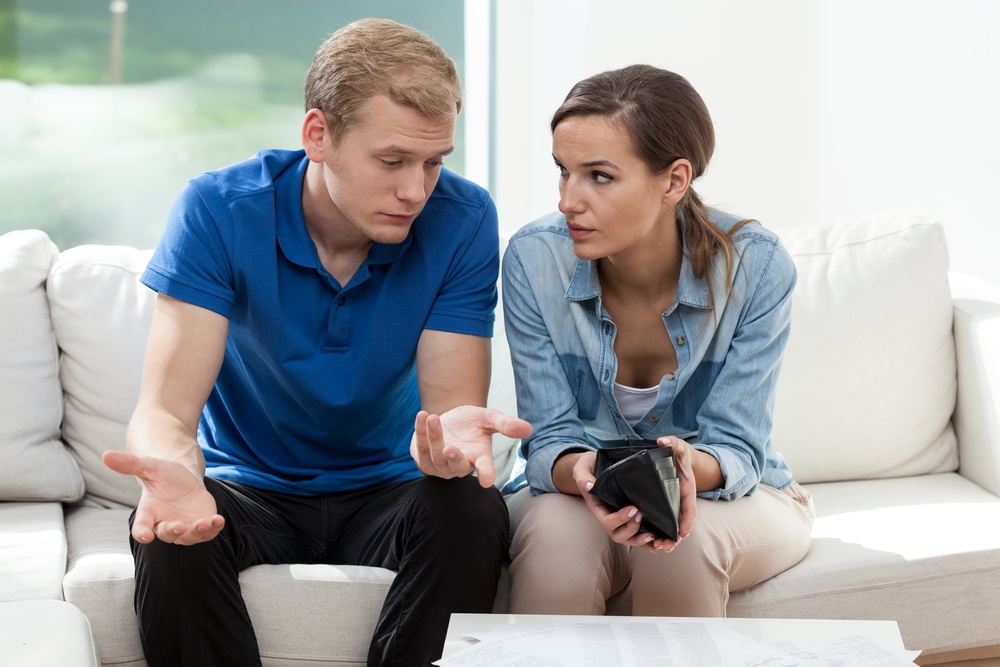 Couple talking finances | First Alliance Credit Union 
