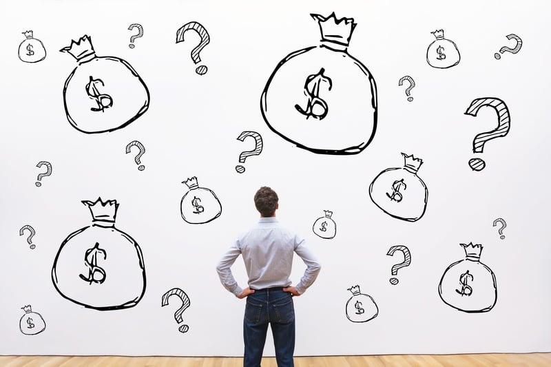 man looking at a wall of debt management solutions first alliance credit union