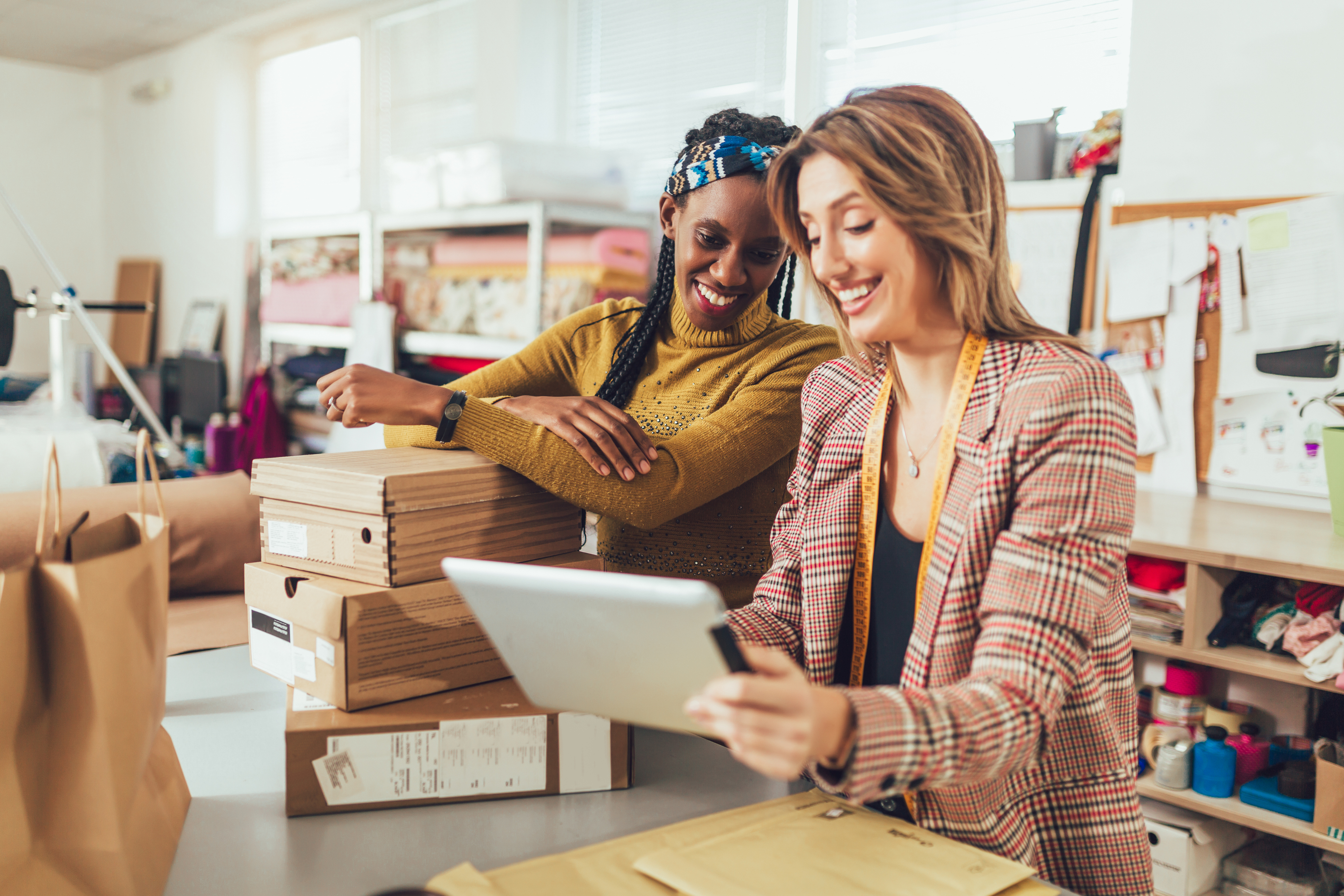 Small business owners looking over their business account | First Alliance Credit Union