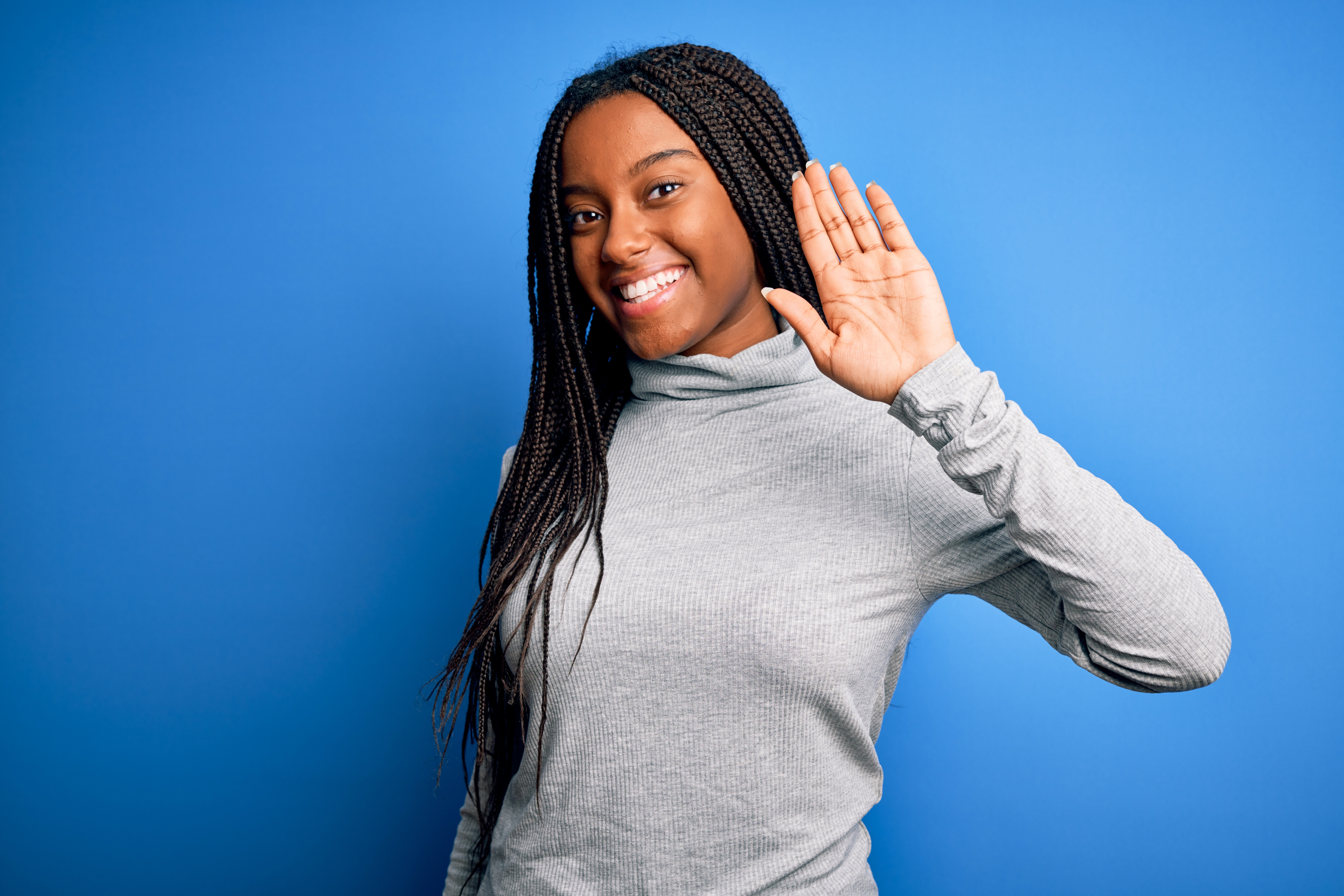 young black woman waiving goodbye to excessive withdrawal fees first alliance credit union
